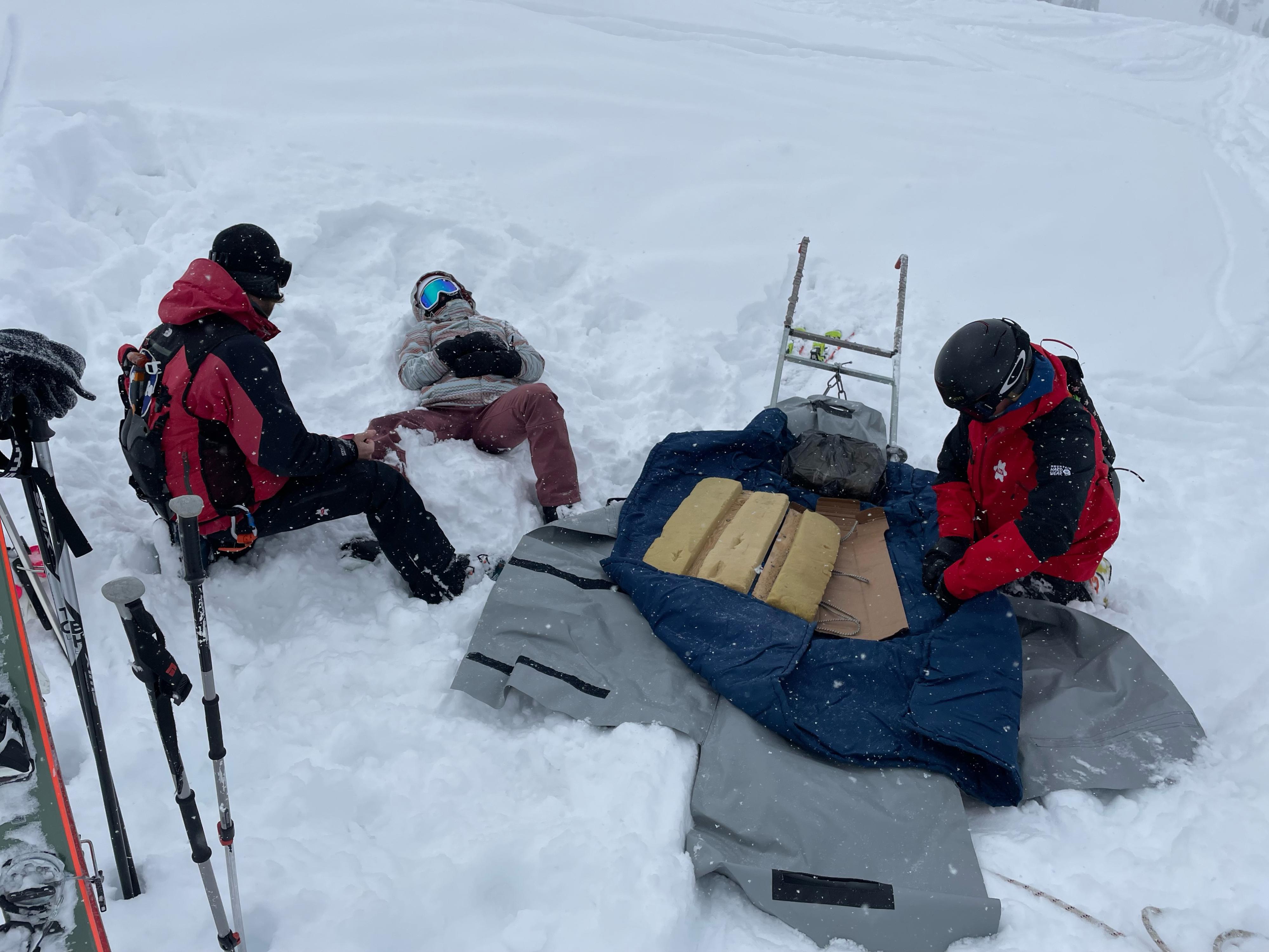 Alta ski patrol puts patient Polly Creveling into a stretcher