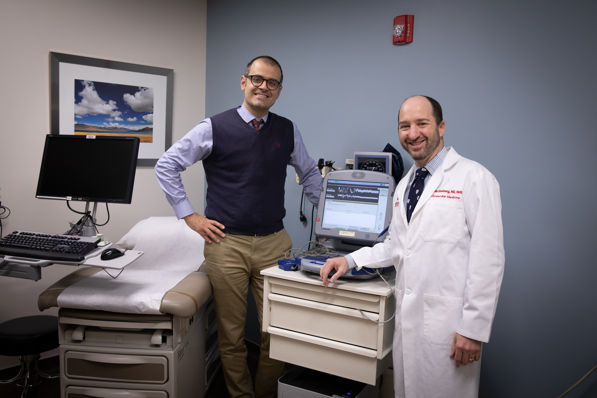Benjamin Sanchez Terrones, Ph.D., and Benjamin Steinberg, M.D. in a clinic room.