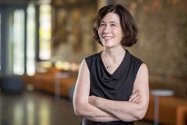 Rachel Hess, M.D., standing in the lobby of a research building