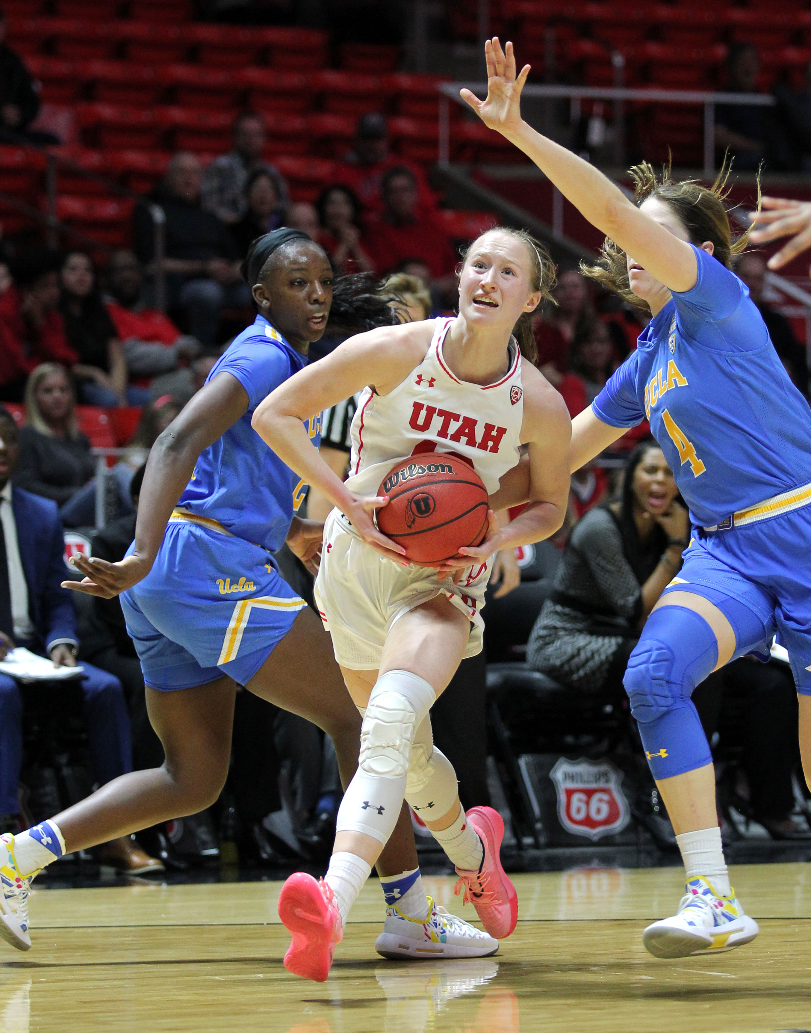 Picture of Dru Gylten getting double teamed by her UCLA opponents during a women's basketball game
