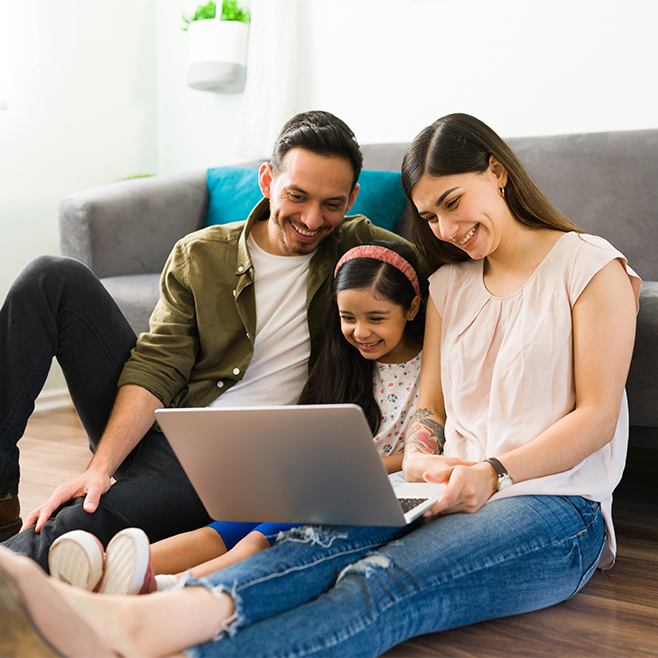 Family Looks at Computer