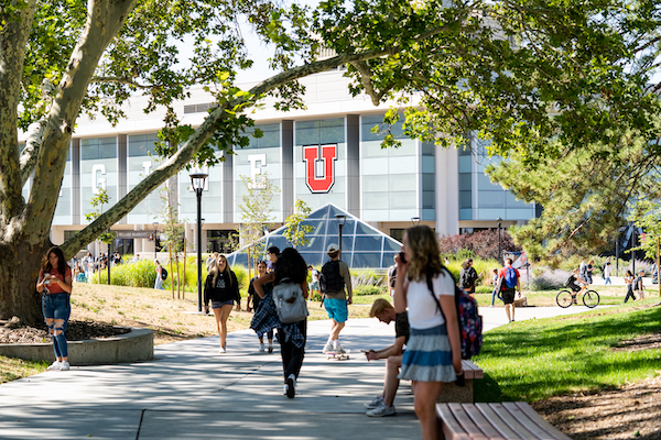 Group of University of Utah students walking outside on campus