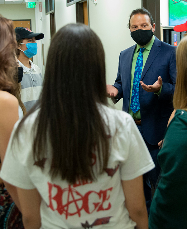 Dr. Langenecker talking to a group of youth