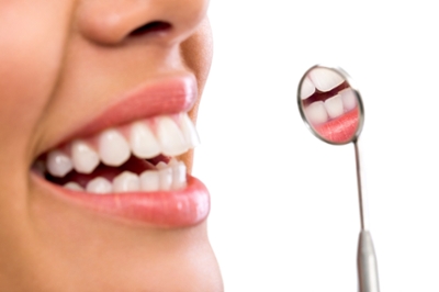 Teeth reflection in tiny dental mirror