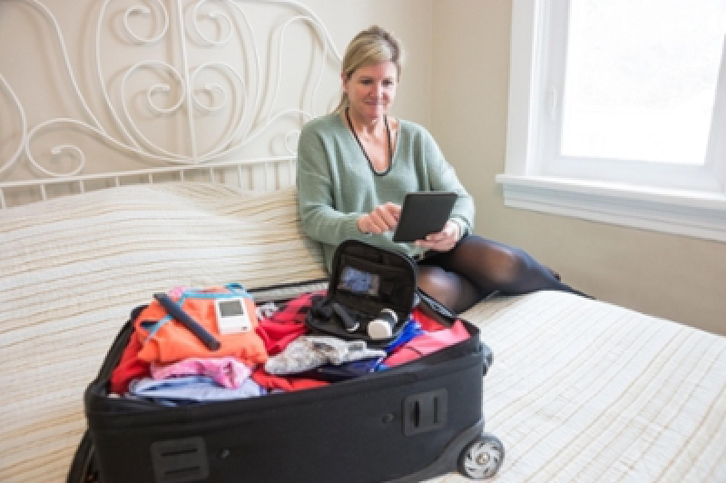 Woman with a packed suitcase
