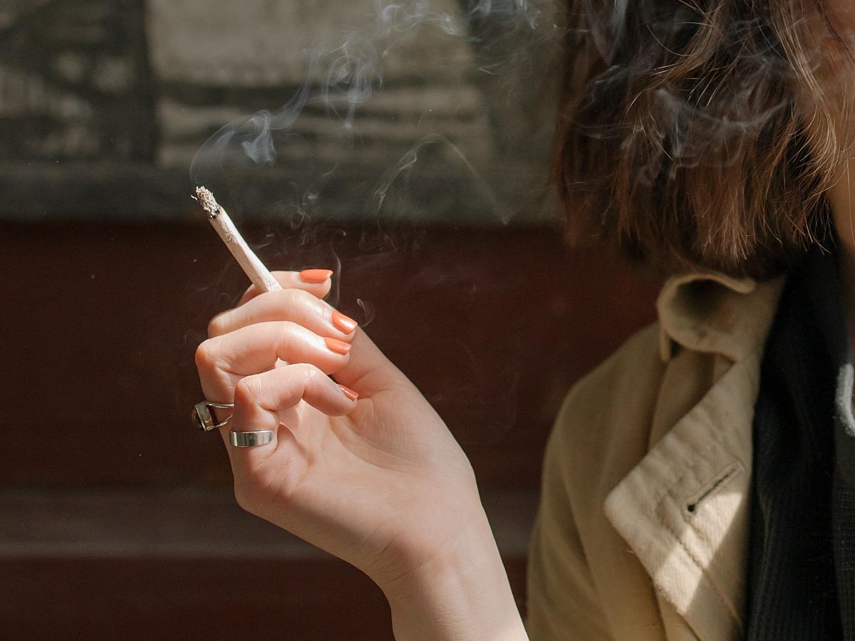 Woman holding a joint.