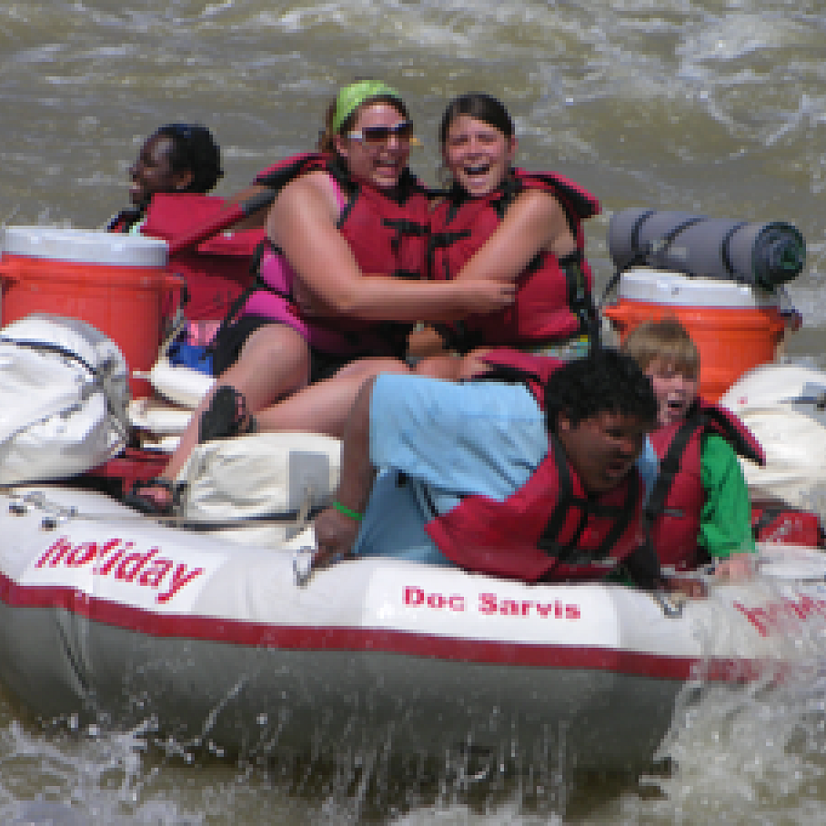 Campers Rafting on the River