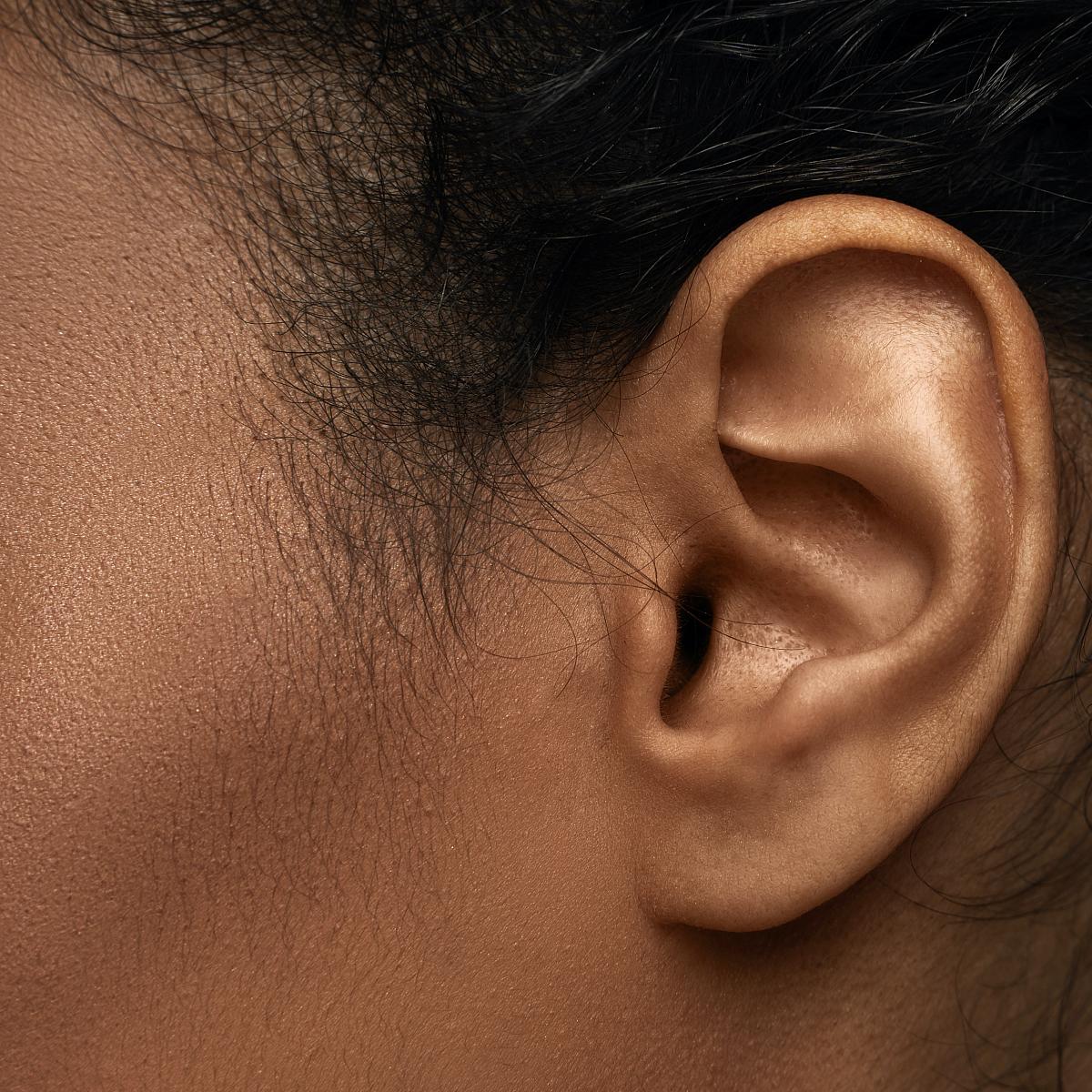 side profile of woman's ear
