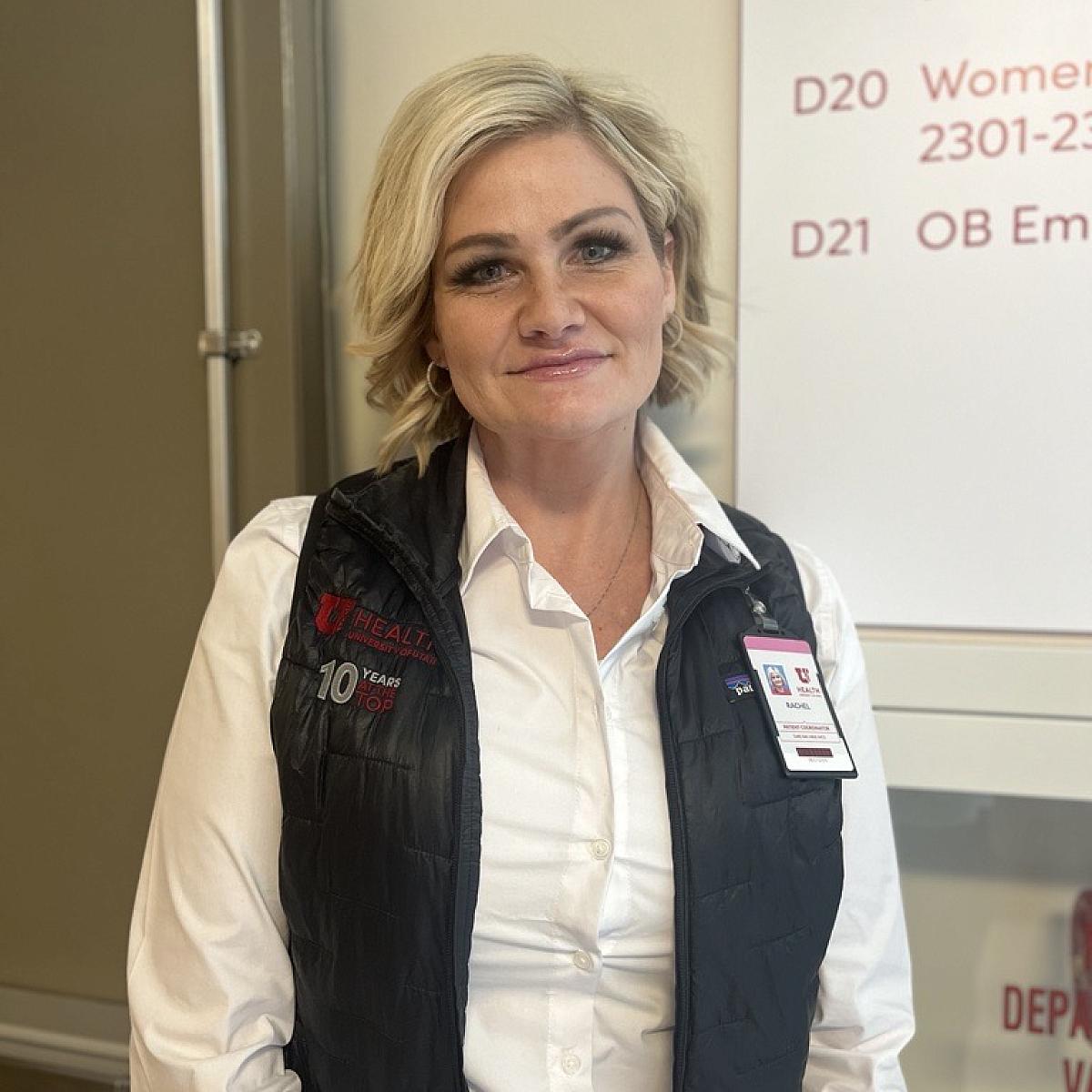 Rachel Harbert, high-risk pregnancy patient and now patient coordinator at U of U Health, standing in a hallway at University of Utah Hospital