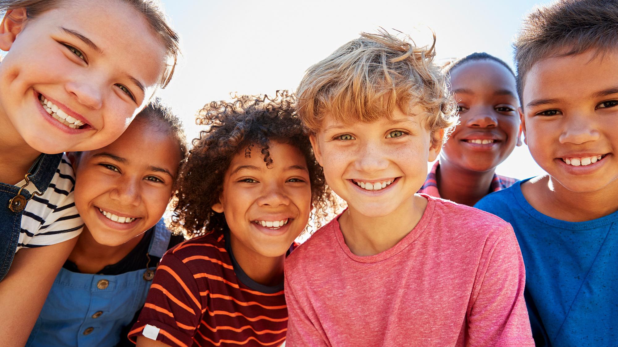 Diverse group of smiling young children
