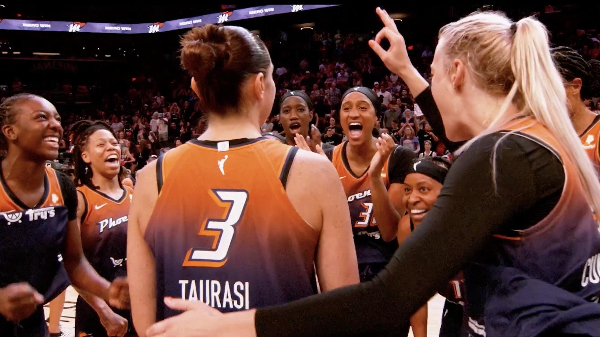 WNBA players in a huddle